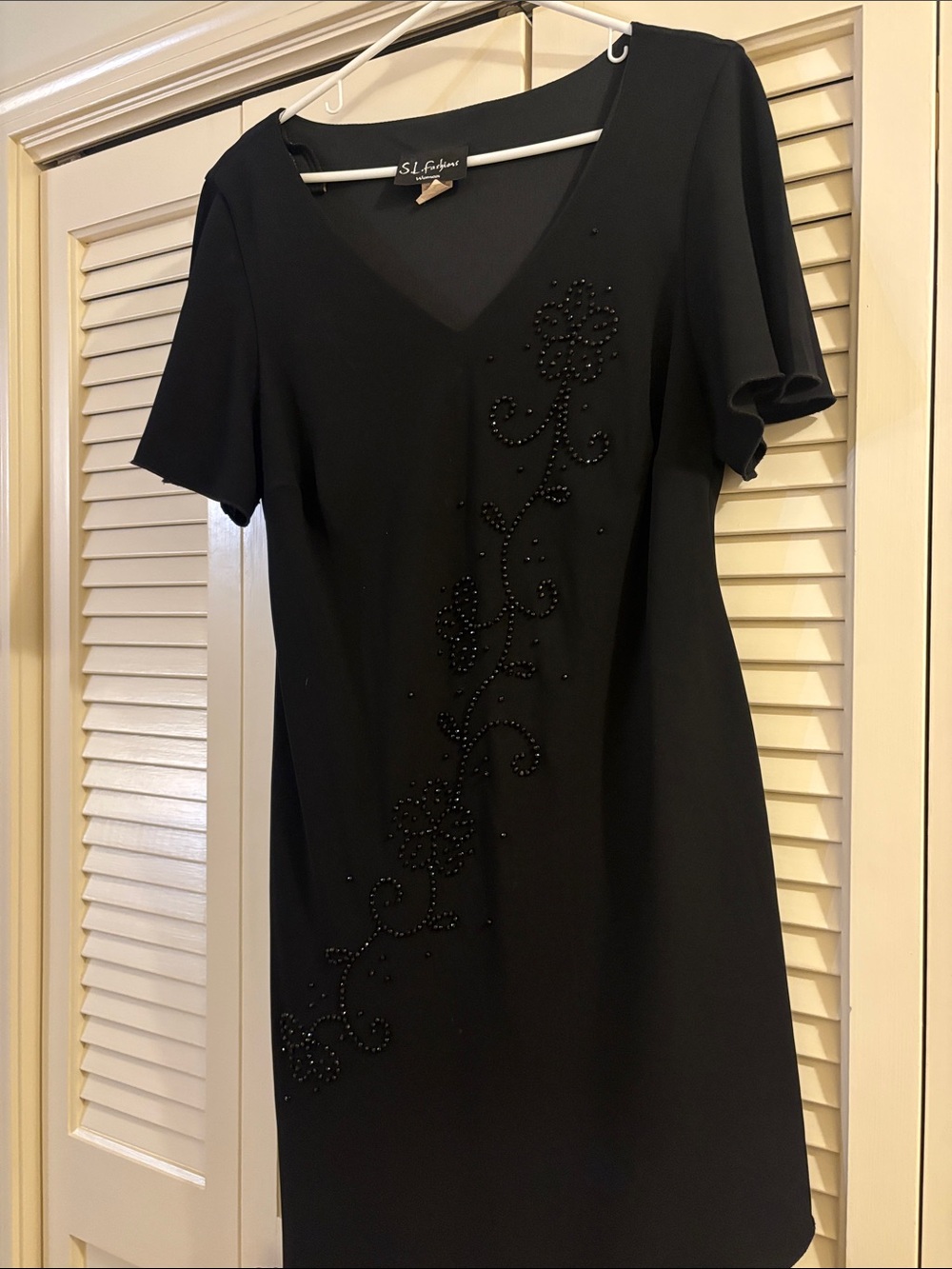 S.L. Fashions Black Beaded V-Neck Dress with Floral Embellishment